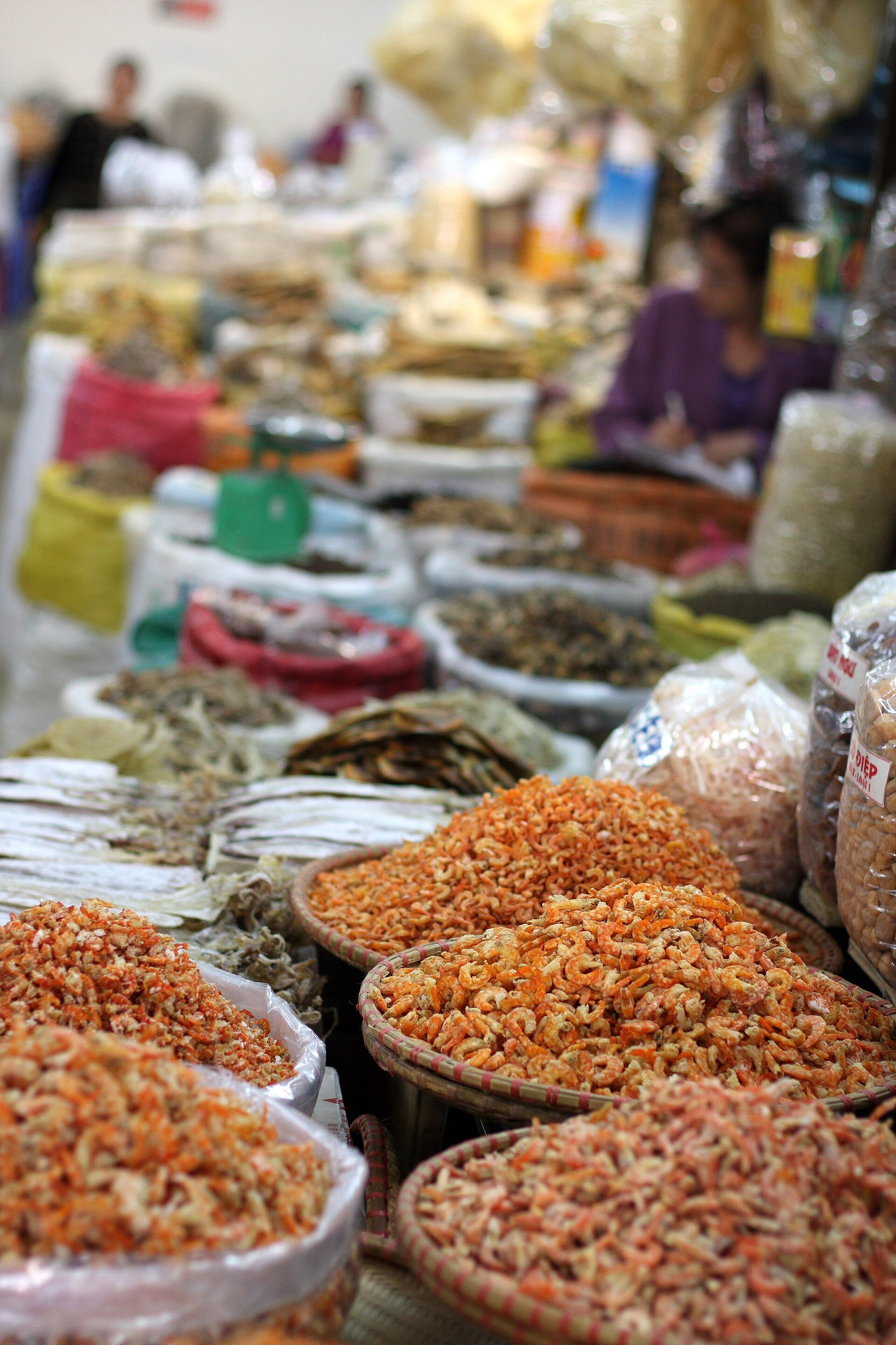 Trays of dried goods and spices on a market stall