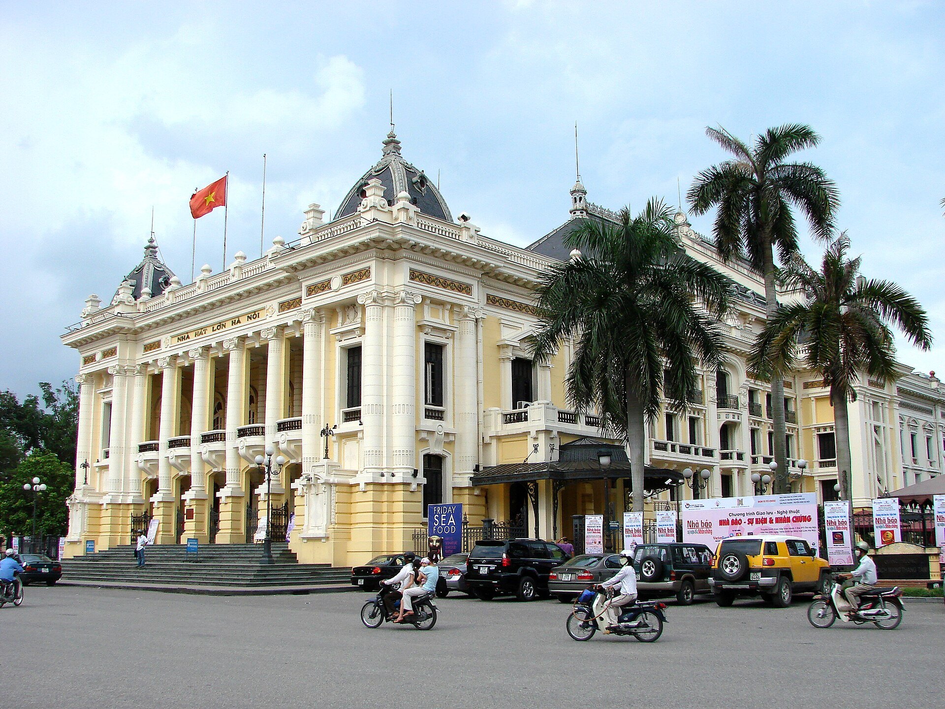 The Opera House seen past palms from the square