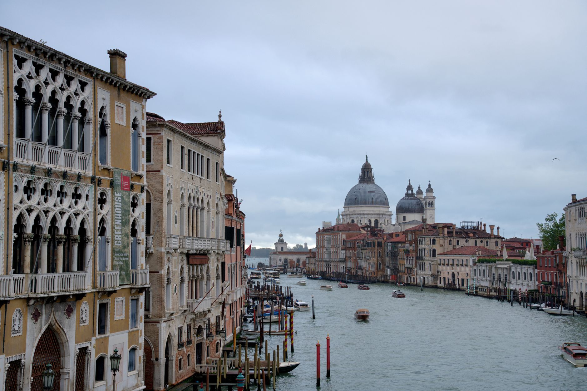 Venice's Grand Canal with historic architecture on a cloudy day