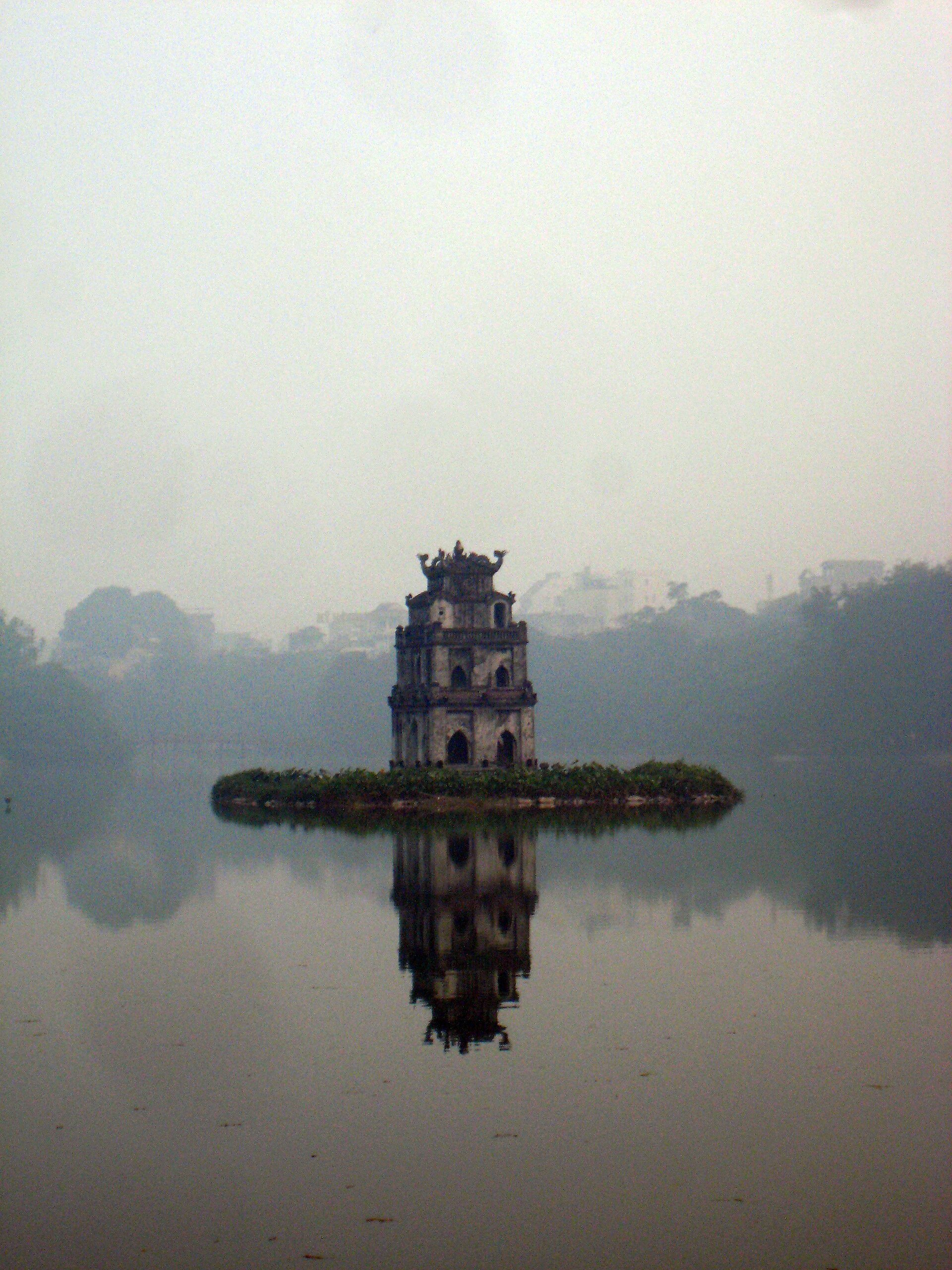 The Turtle Tower in morning mist on the lake