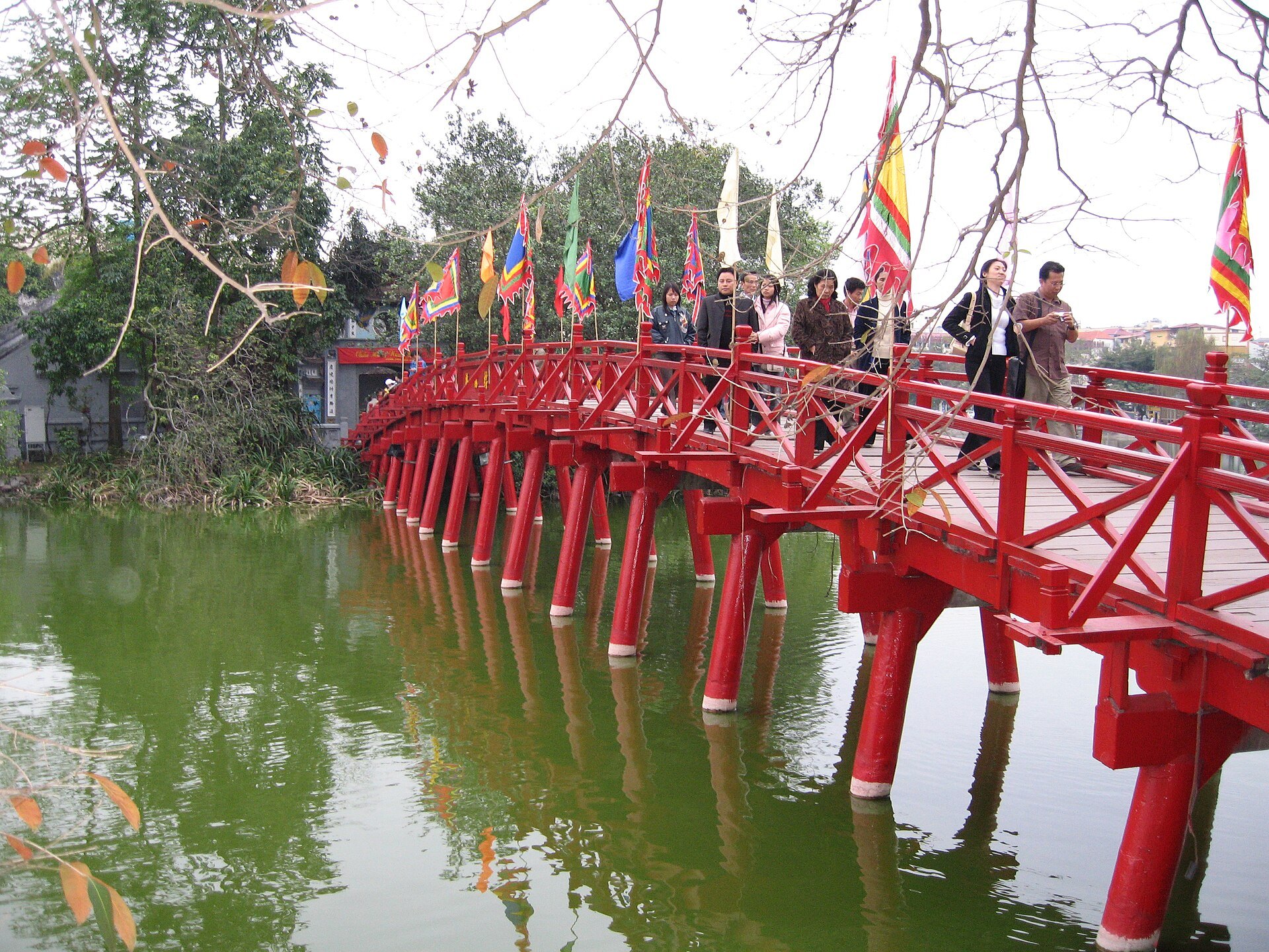 The Thê Húc bridge with Vietnamese flags along its rail