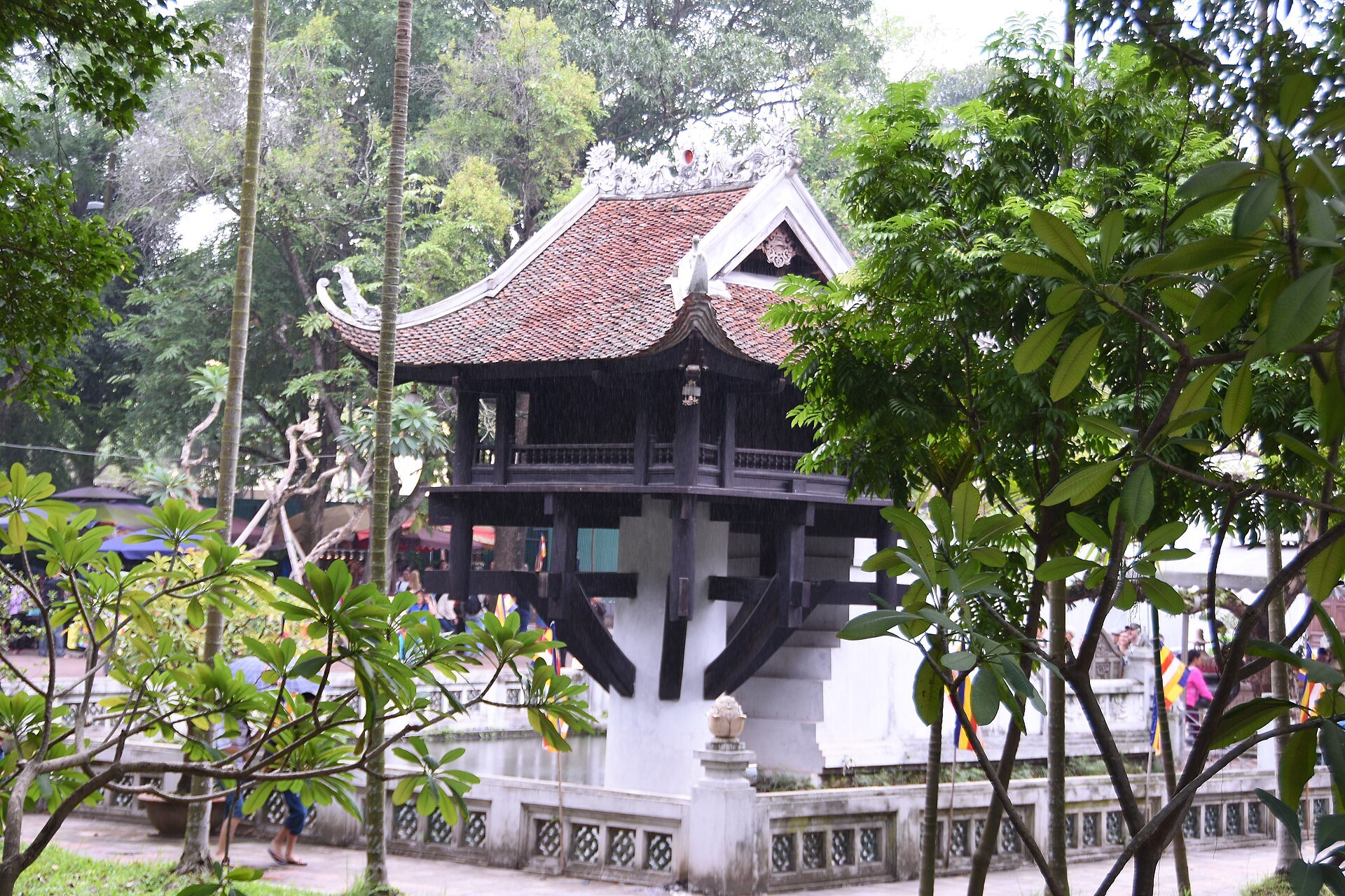 The small wooden pagoda with its curved roof among the trees