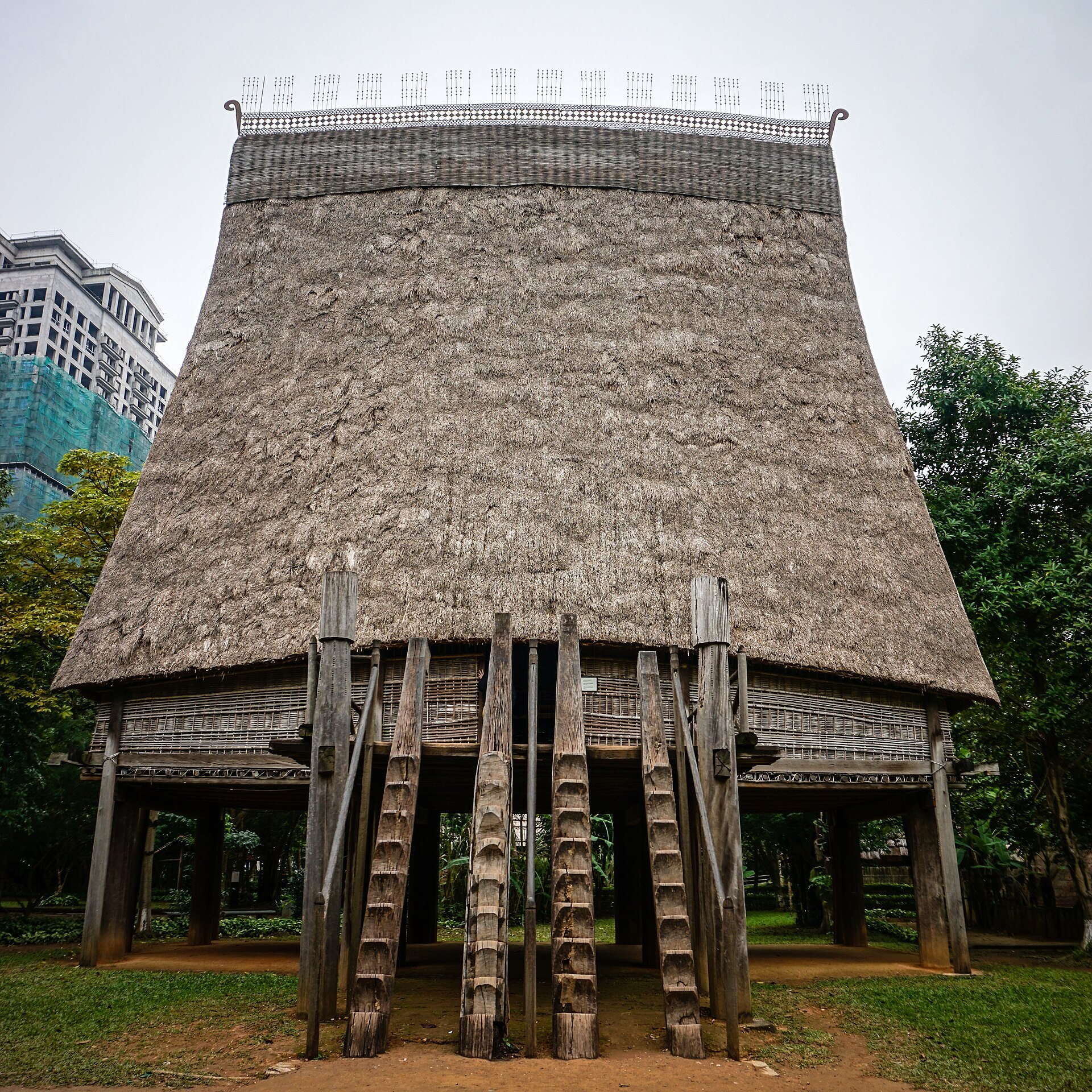 A Bahnar communal house with its tall thatched roof at the Museum of Ethnology