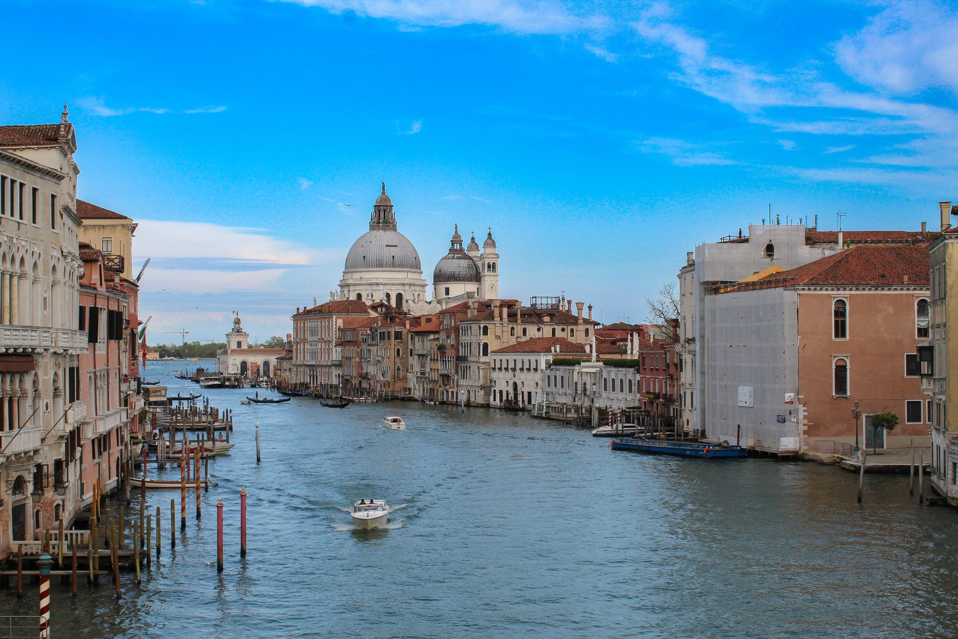 Grand Canal with historic architecture and blue skies in Venice, Italy
