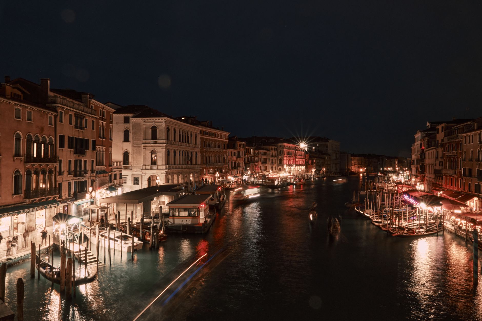 Venice's Grand Canal with city lights reflecting on the water