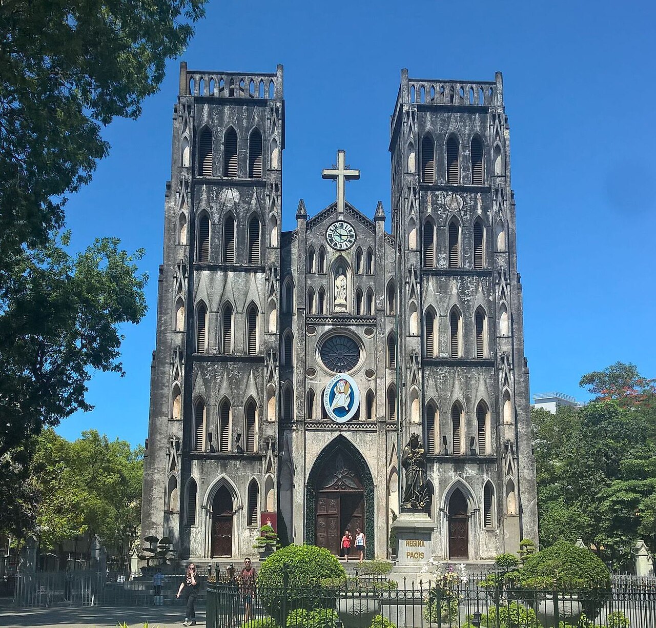 The twin stone towers of St Joseph's Cathedral above the square