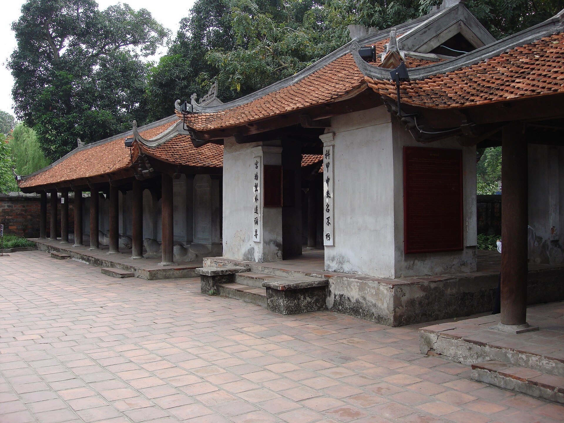 A courtyard of the Temple of Literature with low tiled buildings around it