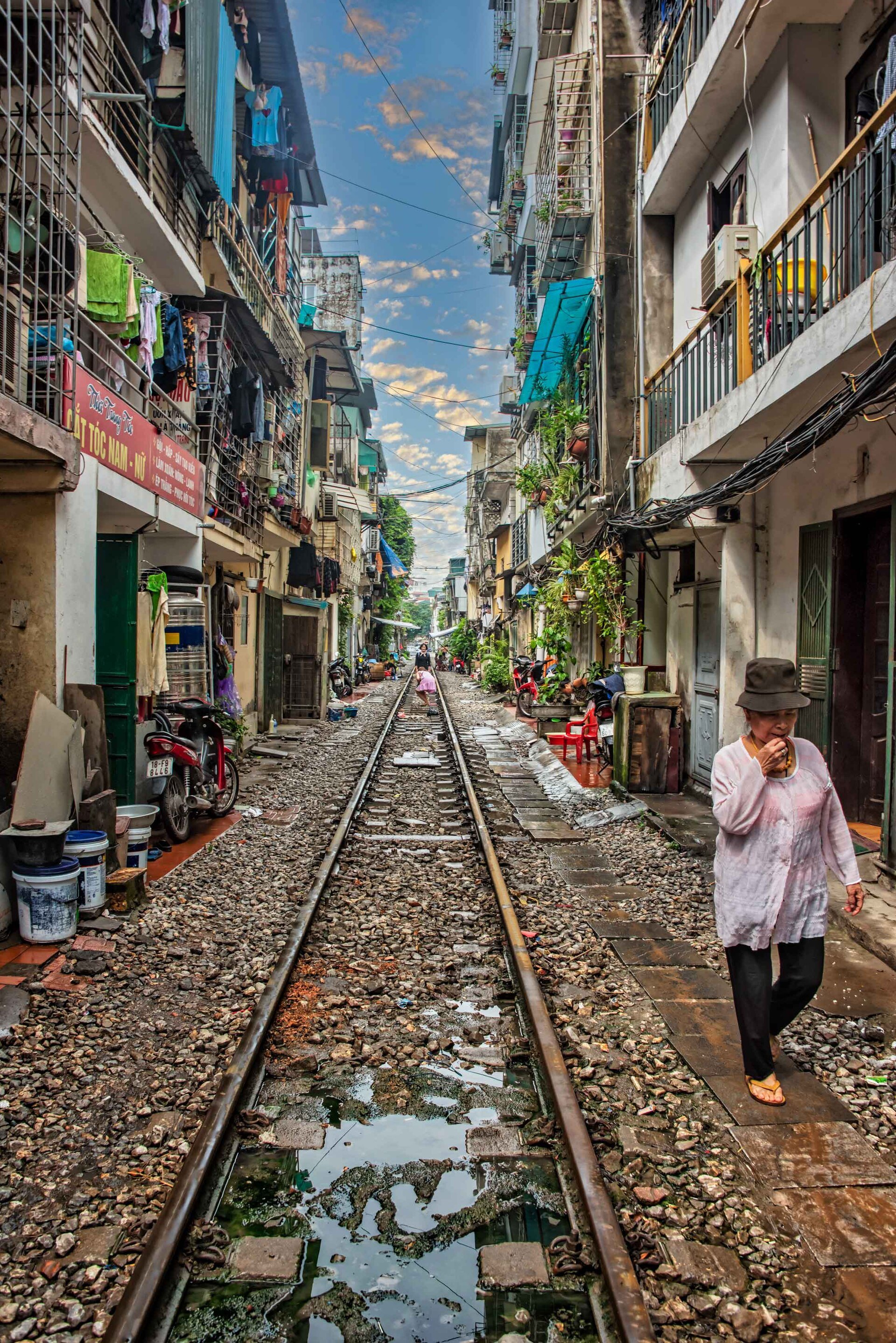The rails running away between narrow painted houses