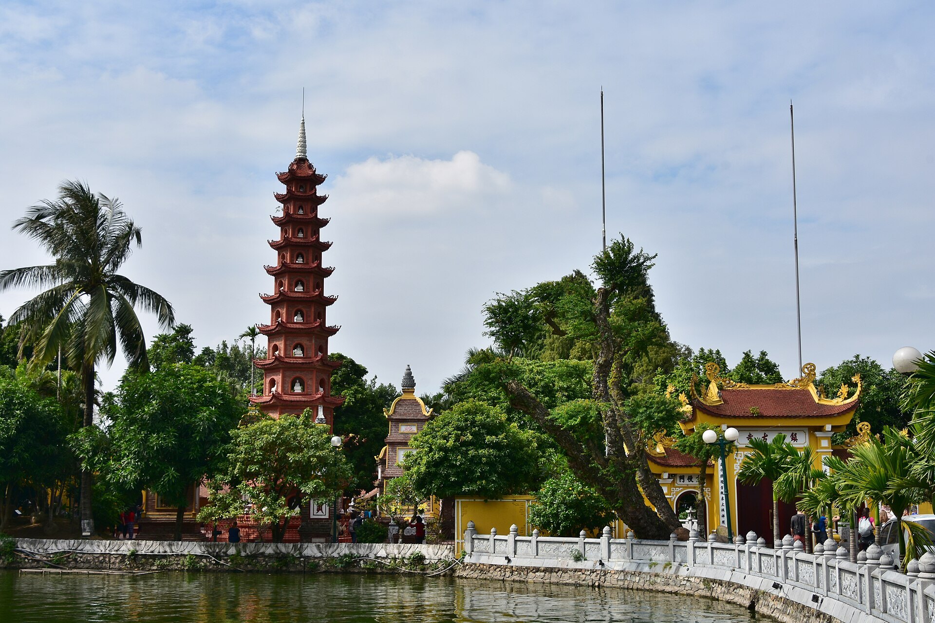 The pagoda seen through palms from the lakeside