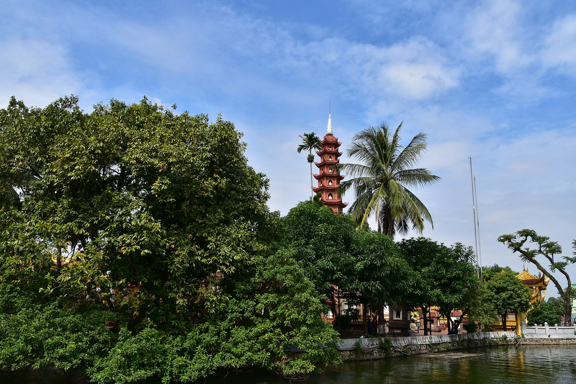 The tiered pagoda above the trees at the water's edge