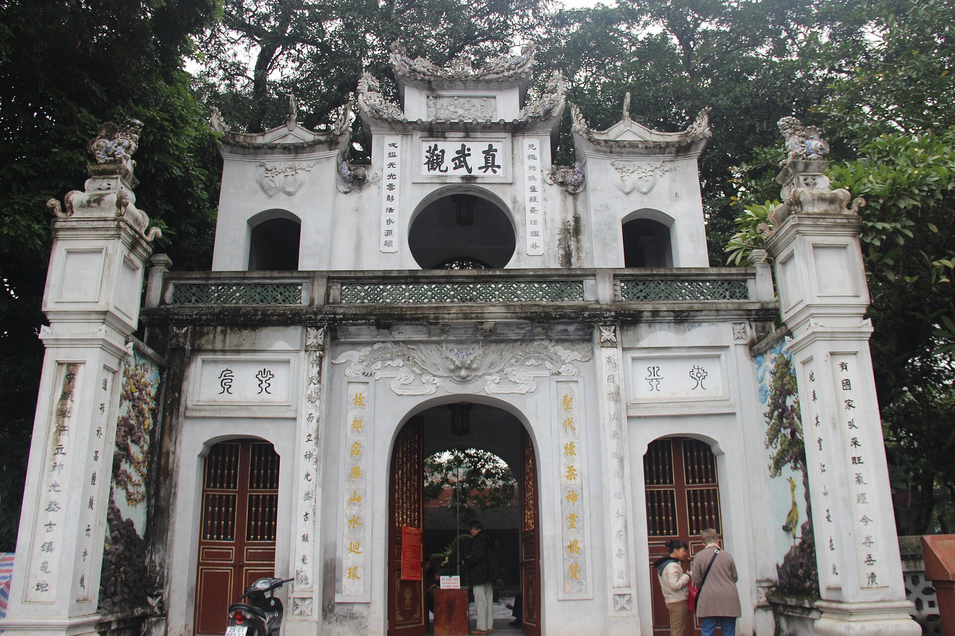 The white ornamental gate of Quan Thanh Temple beside West Lake