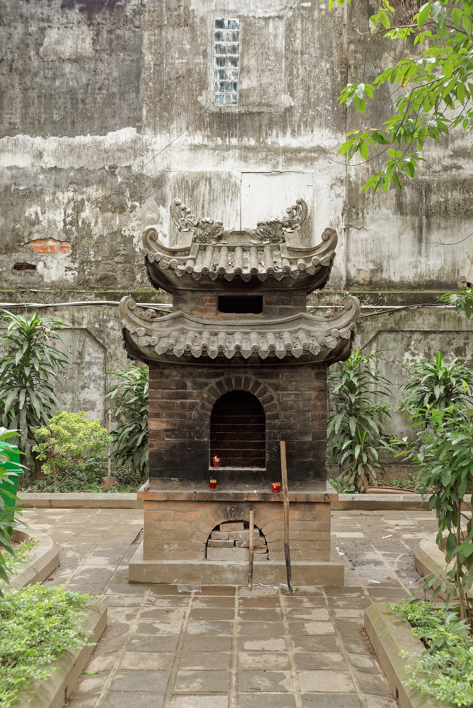A weathered stone gateway in the temple grounds