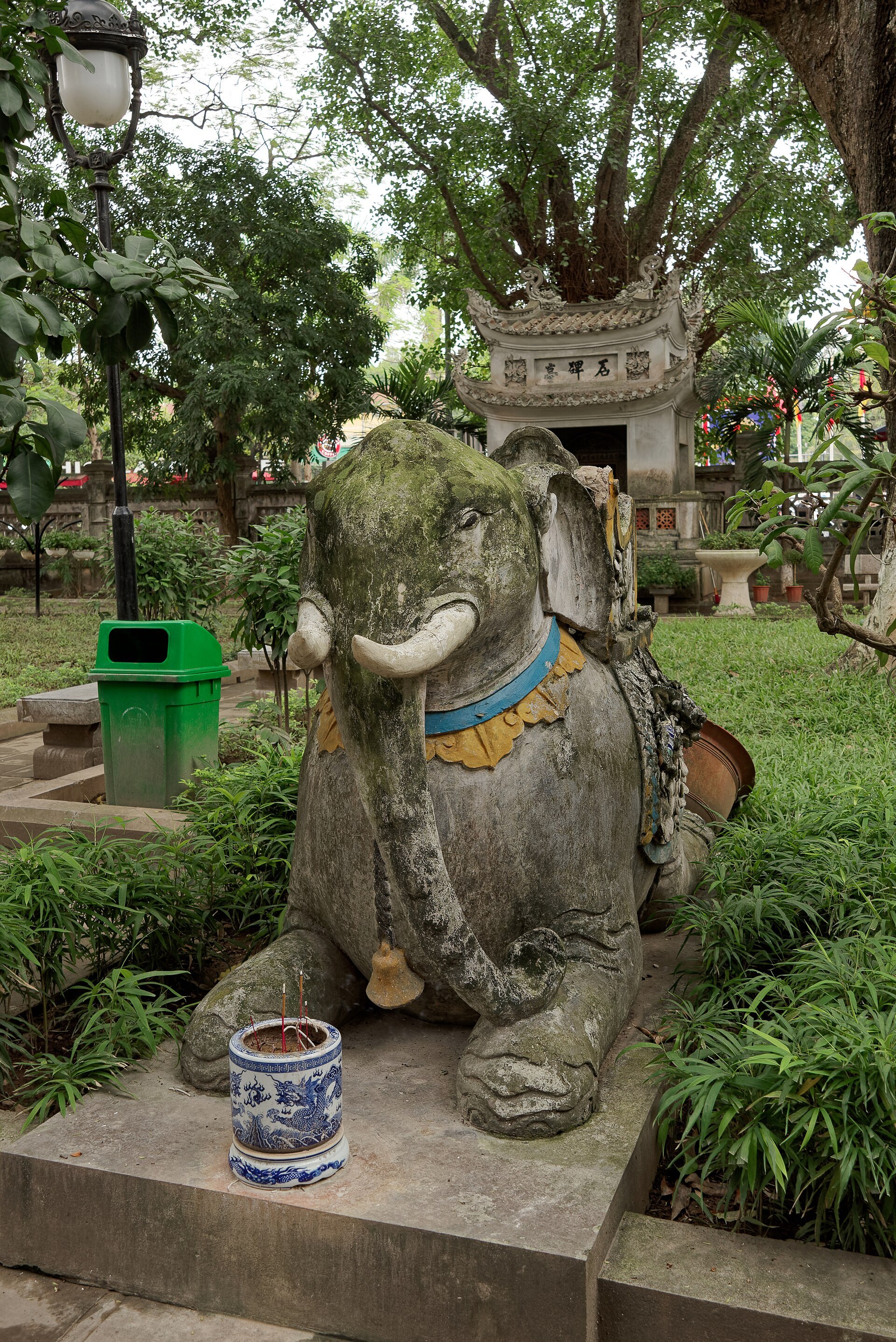 A carved stone elephant in the temple garden